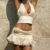 Wheremery Elegant Two-piece Y2K Summer New White Sexy V-neck Backless Women’s Top and Pleated Lace Mini Skirt Women’s Set