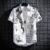 Summer Shortsleeved Shirt Mens Thin Graffiti Newspaper Printed Hong Kongstyle Trendy Top Clothes Duffy Handsome Loose Halfsleeved Shirt